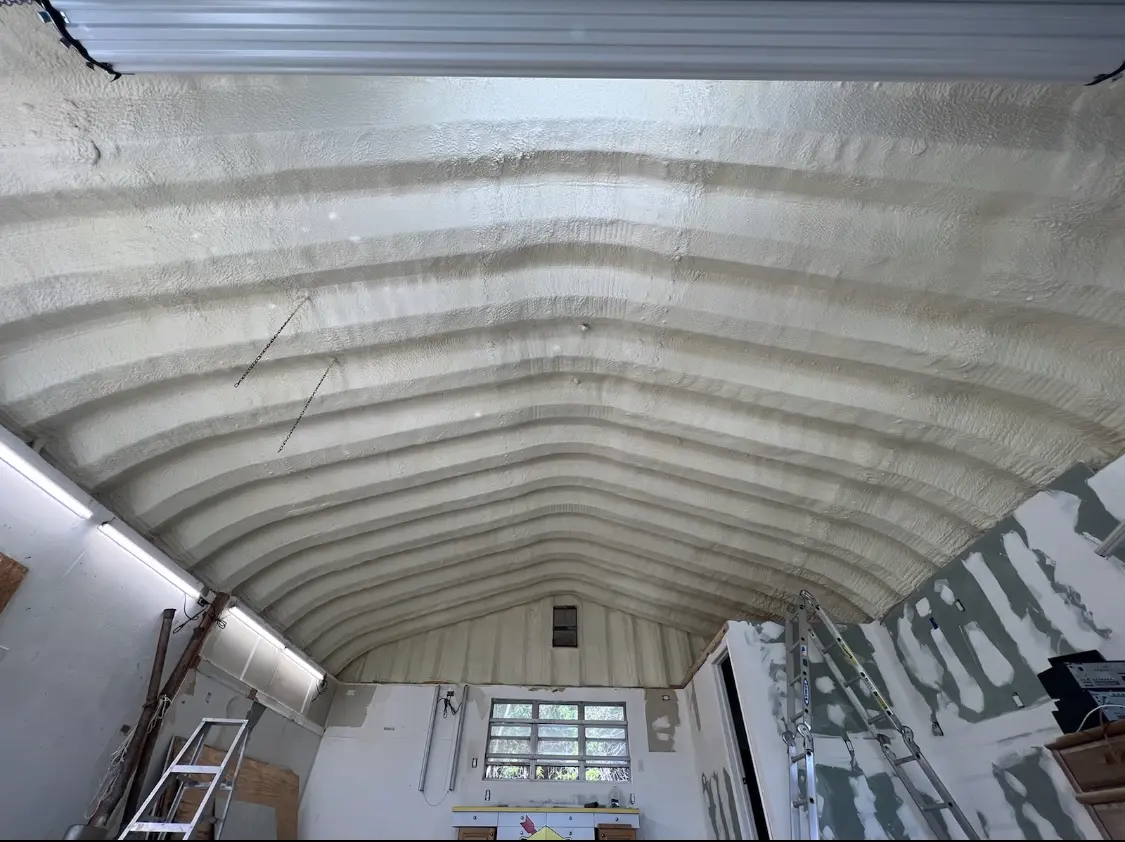Spray polyurethane foam applied to the underside of a metal roof deck in Wheaton